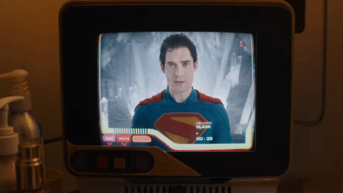 Supergirl star Milly Alcock shown on screen in costume, preparing for public backlash while simply existing.