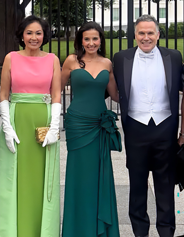 Three individuals, two women and one man, in formal attire outside. Examining MAGA figures' worst looks.