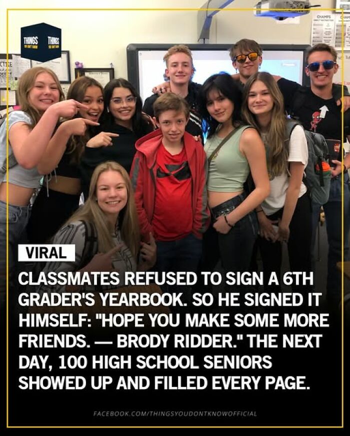 Group of teens smiling in a classroom celebrating a viral story of kindness and friendship in our world today.
