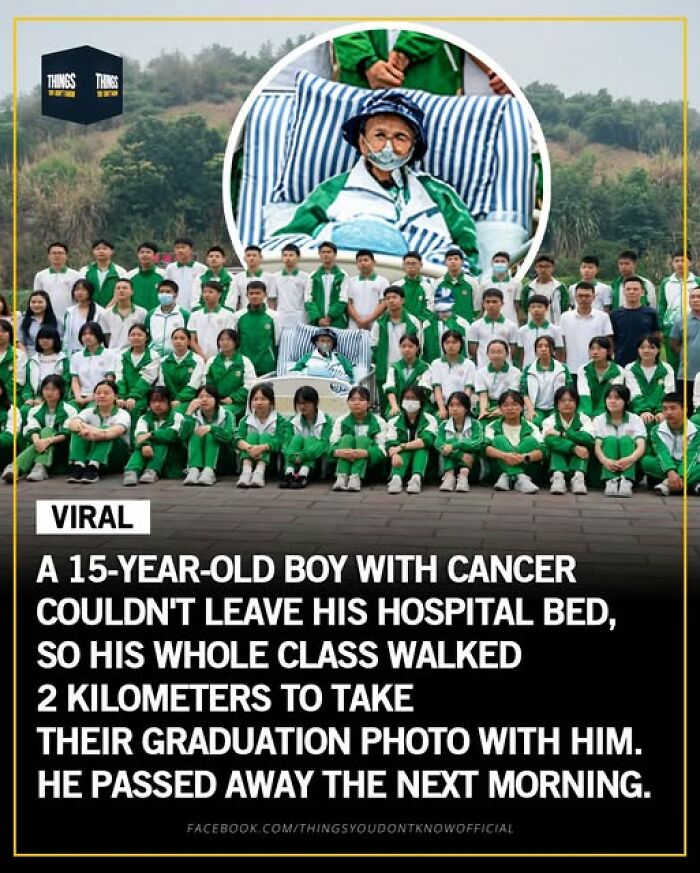 A group of students in green and white uniforms take a graduation photo with a terminally ill classmate in a hospital bed.