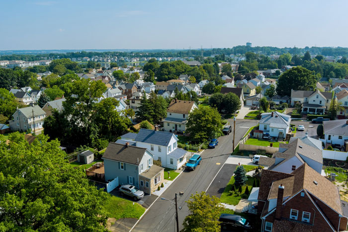 Aerial view of suburban neighborhood representing an HOA community where a dad challenges the board over a trampoline dispute.