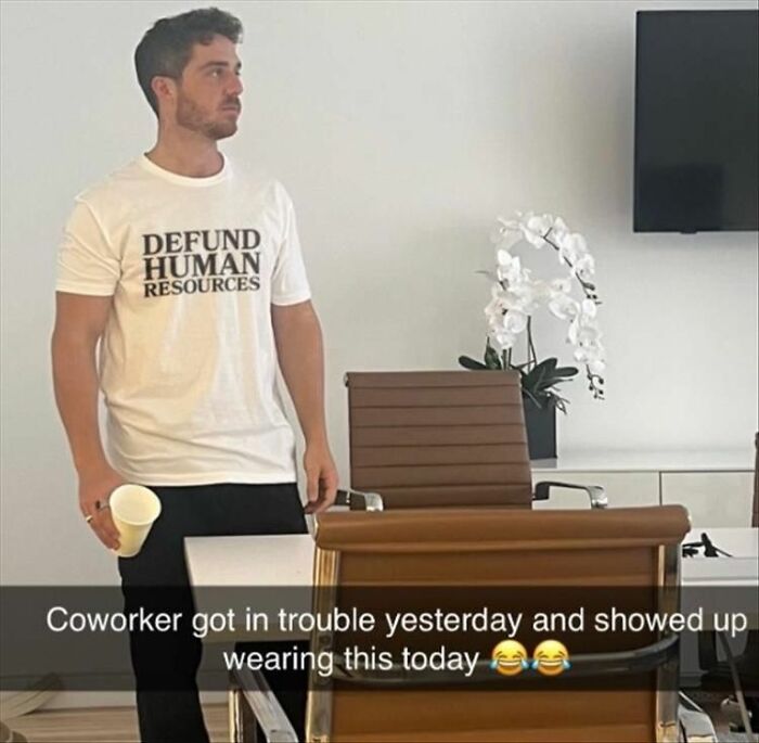 Man in a DEFUND HUMAN RESOURCES shirt, creating an unhinged meme. This might make your inner goblin laugh.