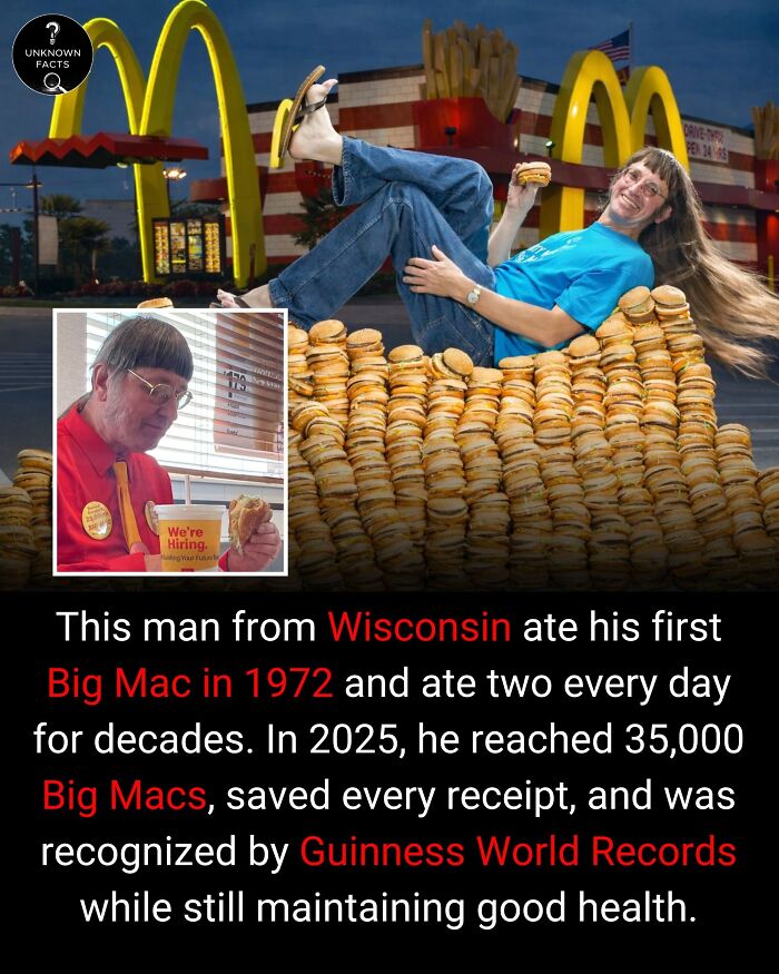 A man with long hair, lying on a mountain of Big Macs outside McDonald's, showcasing interesting facts.