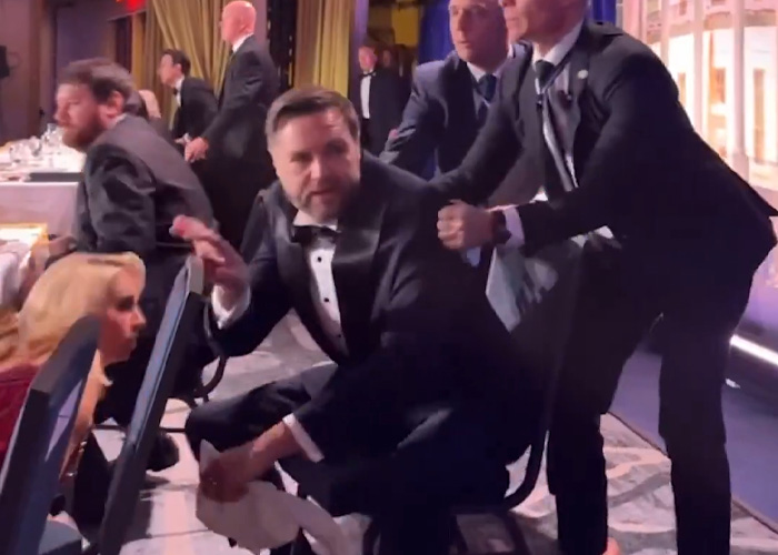 A White House Correspondents Dinner attacker, identified as a California teacher, is escorted from the event.