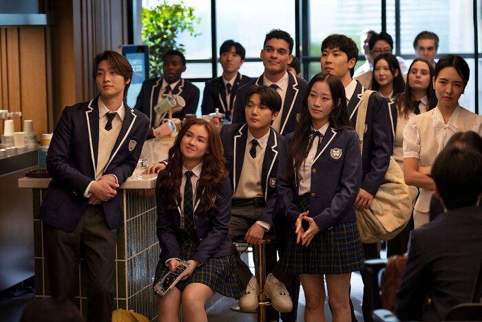Group of students in school uniforms from XO Kitty season 3, showcasing new tension and messy dynamics in the series.