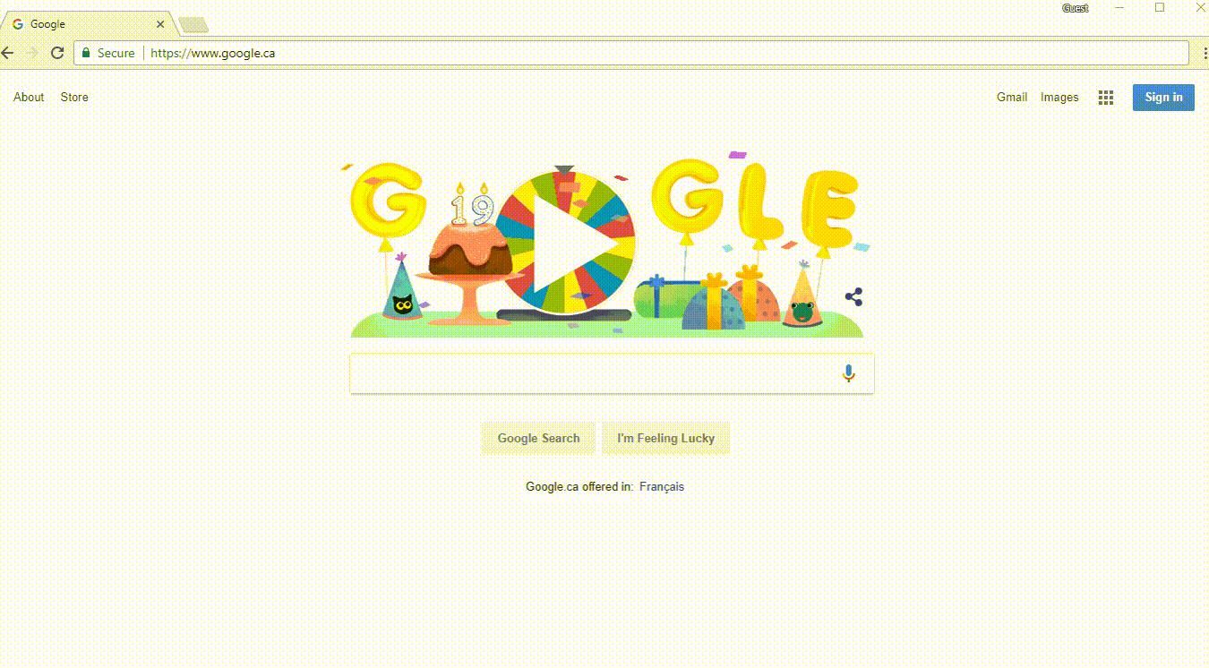 Google homepage with interactive Easter egg doodle featuring a birthday cake, party hats, and a colorful spinning wheel game.