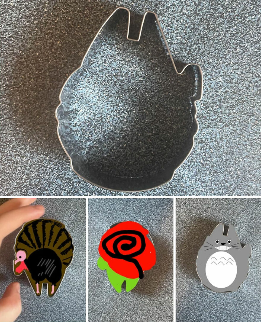 A metal cookie cutter and three decorated cookies below it: a turkey, a rose, and Totoro, demonstrating various cookie shapes.