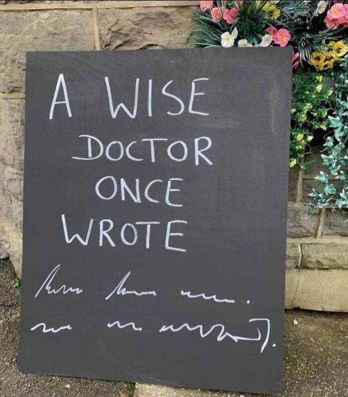 A chalkboard sign with illegible text that reads "A wise DOCTOR once wrote". A funny medical meme.