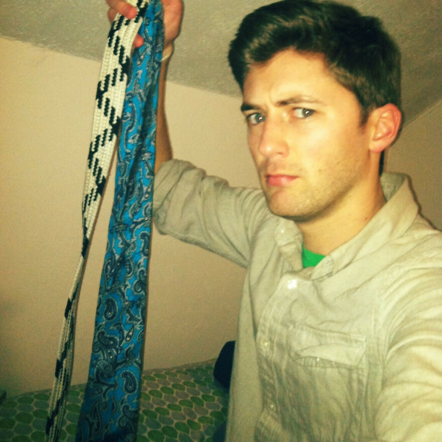 Man in a button-up shirt with an intense expression, holding up two belts, implying moments liars get caught.