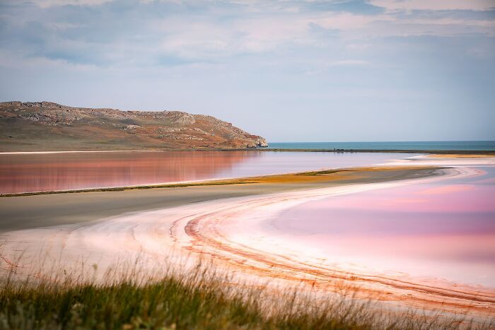 Pink salt lake with stunning natural views and colorful water patterns