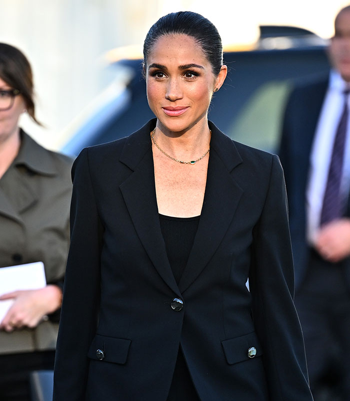 Close up of Meghan Markle wearing black blazer at children's online safety event