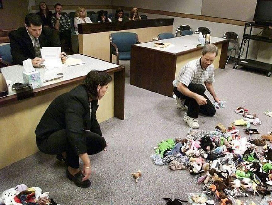 People sorting and organizing many dolls during a custody dispute in a courtroom about co-parenting with a toxic ex People sorting and organizing many dolls during a custody dispute in a courtroom about co-parenting with a toxic ex