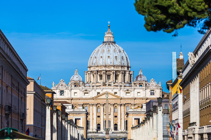 Iconic dome of Vatican City under clear blue sky