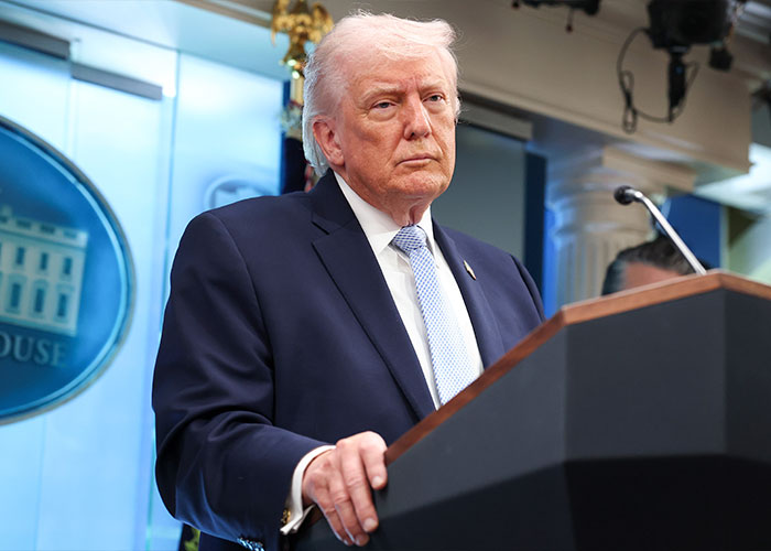 President Trump speaking at White House podium during press briefing President Trump speaking at White House podium during press briefing