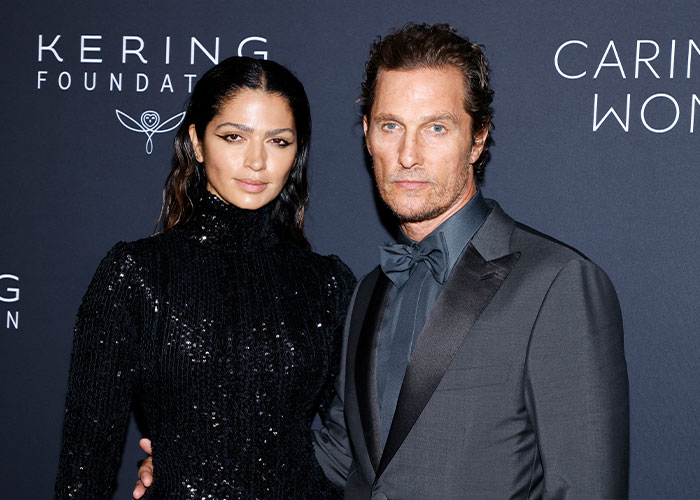 Male celeb Matthew McConaughey at event with partner
