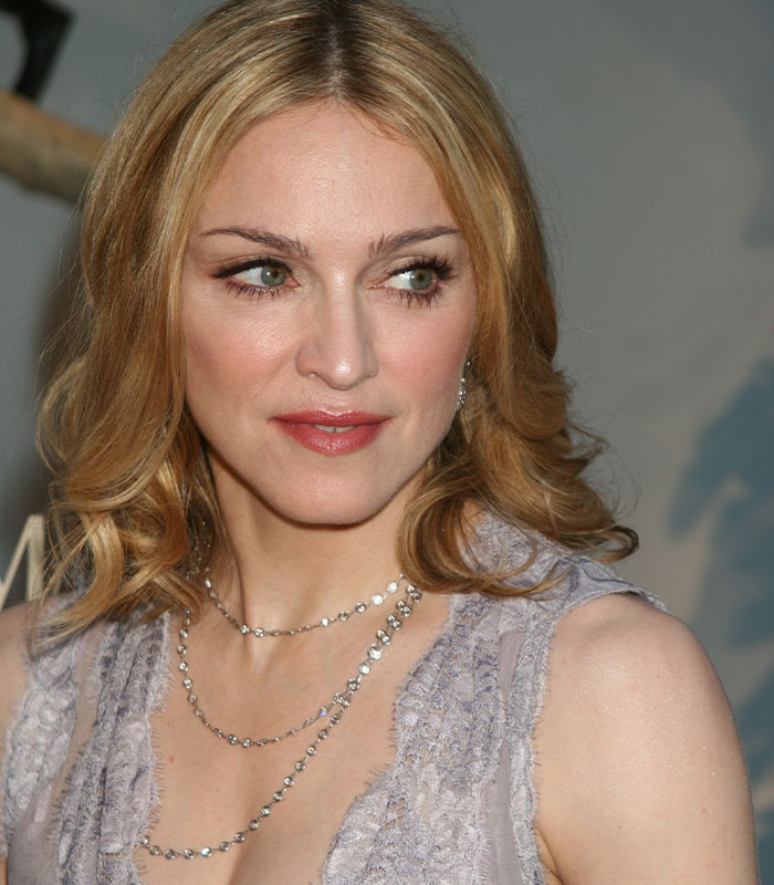 Close-up of Madonna with blonde hair and delicate jewelry Close-up of Madonna with blonde hair and delicate jewelry