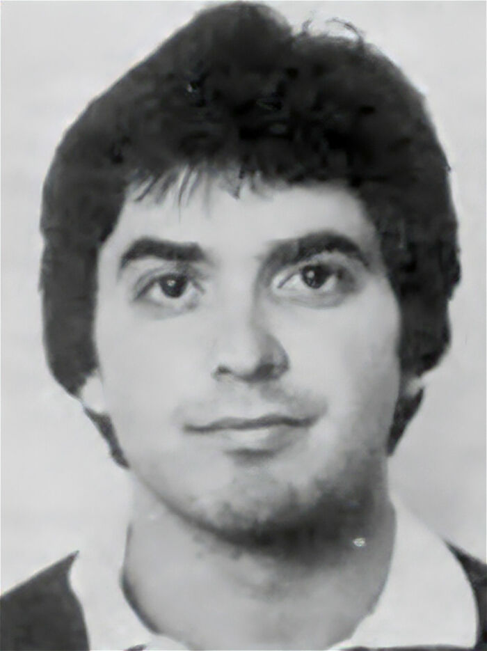 Black and white headshot of man representing career damage