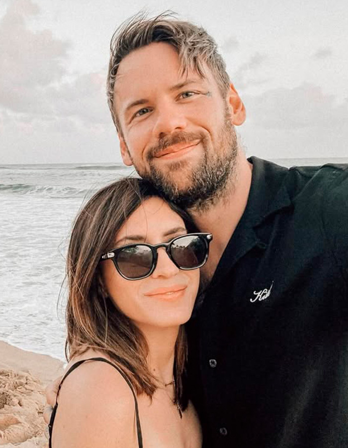 Couple on the beach, man and woman, highlighting stories of famous men coming out gay