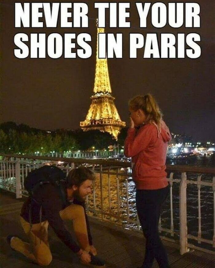 A man ties his shoe in Paris with the Eiffel Tower in the background, making a woman cry. A funny travel meme.