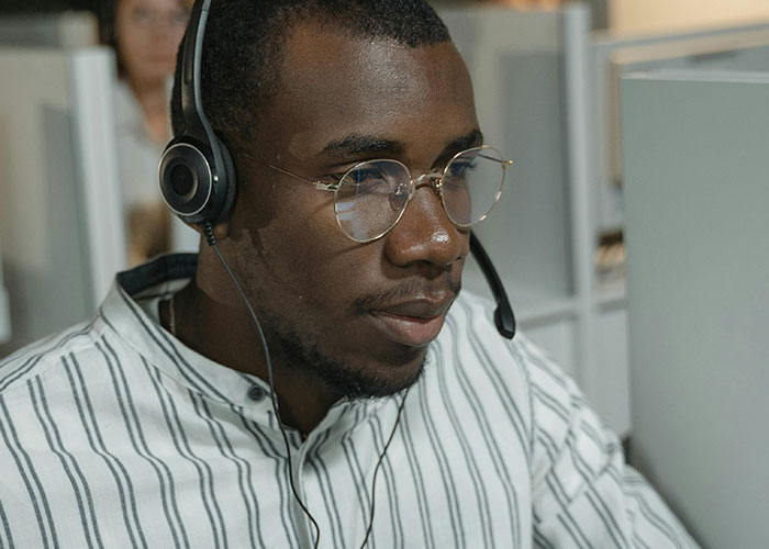 Man wearing headset confused about minor inconvenience emergency