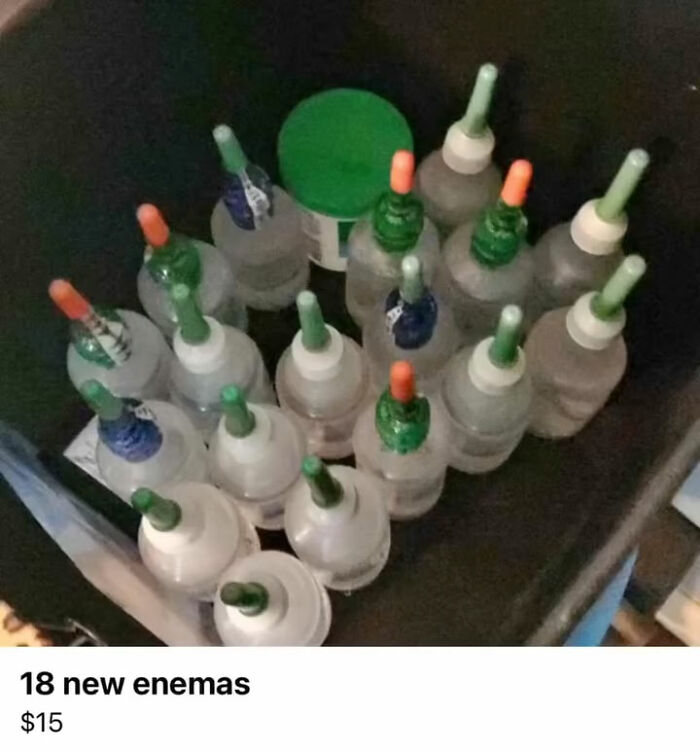 Collection of 18 new enema bottles arranged inside a container