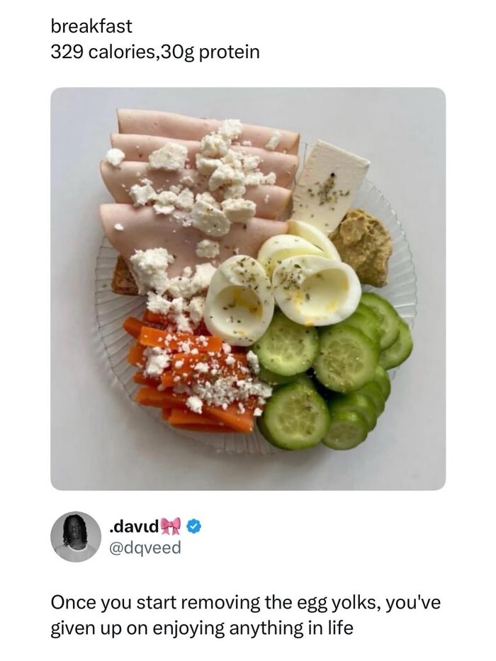 Healthy breakfast plate with turkey, boiled eggs, cucumber, carrots, and feta cheese protein meal