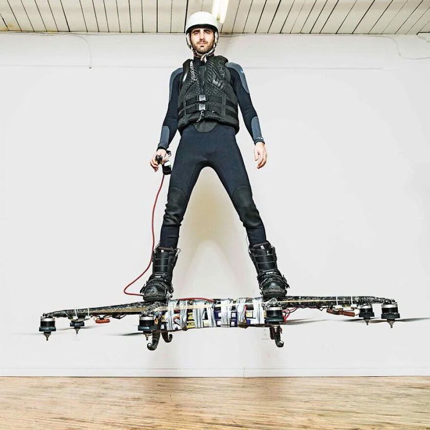 Man riding a futuristic hoverboard with safety gear indoors showing future technology