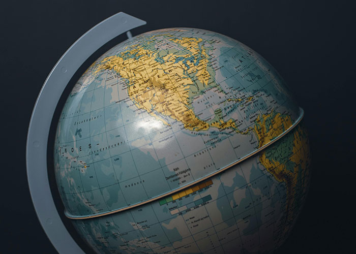 A close-up of a globe, showcasing North America and parts of the ocean. It symbolizes a worldwide perspective on intelligence.
