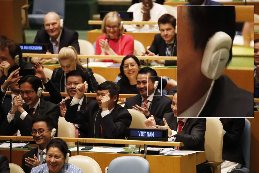 International delegates using advanced headsets for translation at a global conference