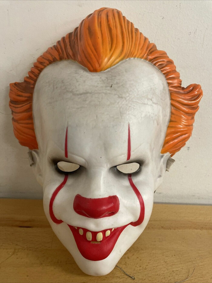 A Pennywise clown mask with orange hair and red clown makeup. One of the weirdest packages mailmen had to deliver.