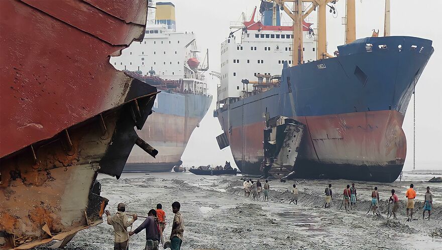 Shipbreaking workers on a muddy shore, dismantling large vessels, depicting one of the most stressful jobs.