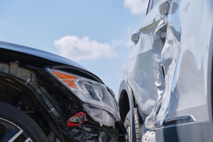 Close-up of damaged cars after crash representing glitch in the matrix accident