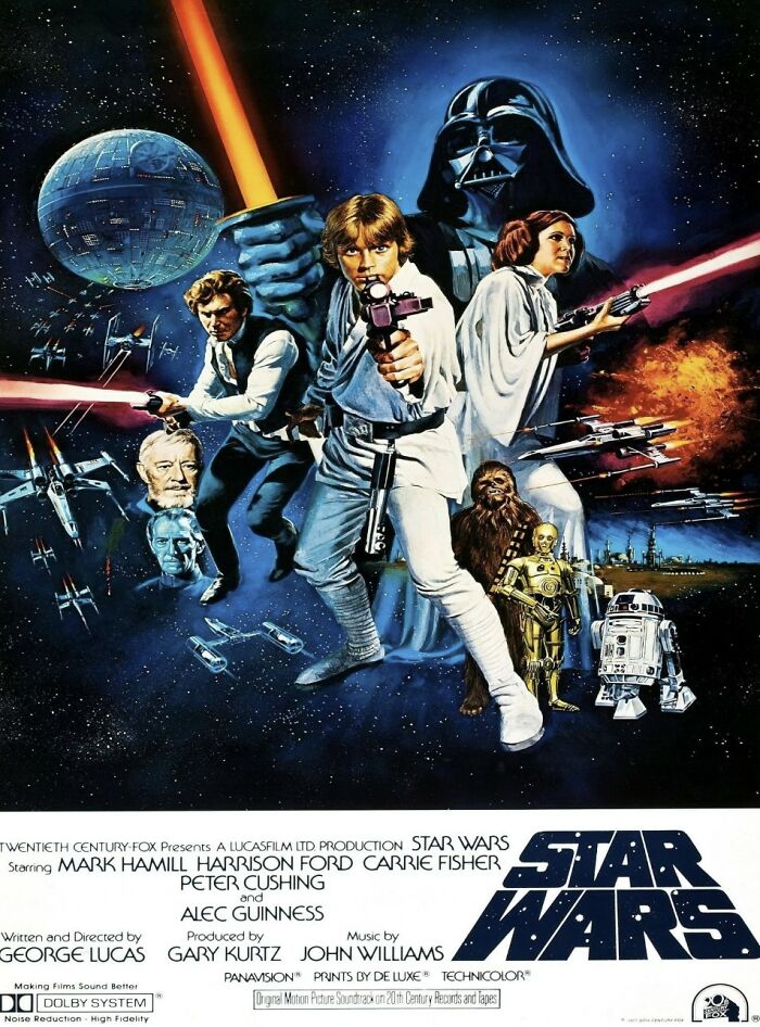 Star Wars movie poster showing main characters and iconic space battle scene