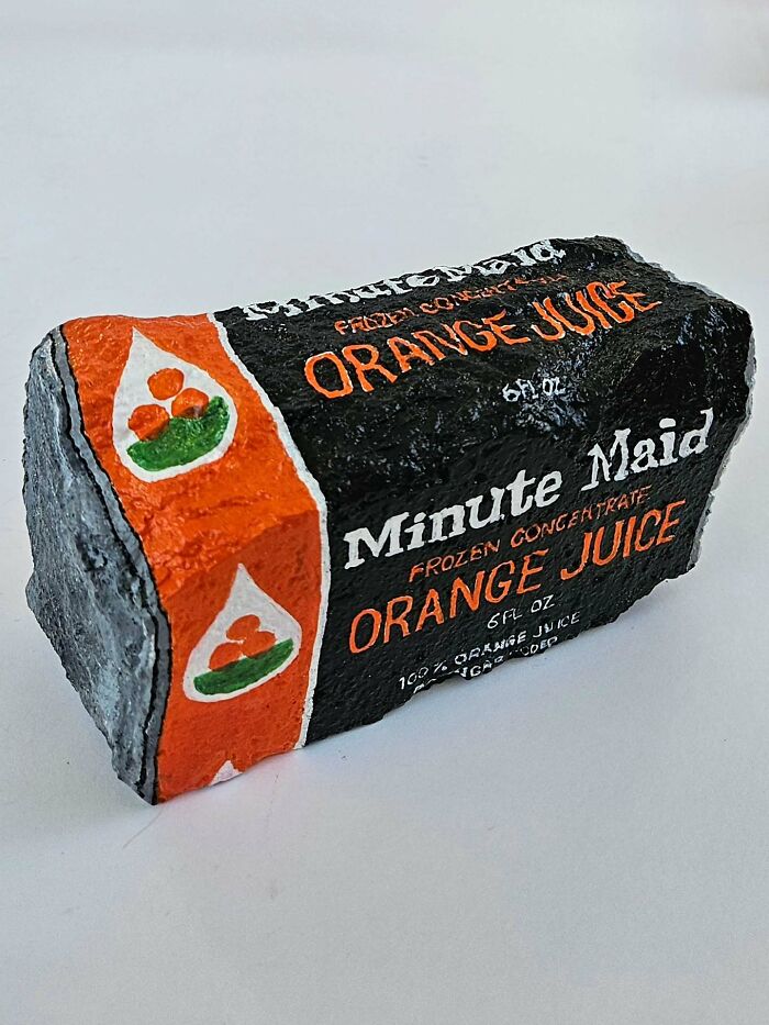 A stone creation resembling a Minute Maid frozen orange juice carton, transforming rocks into iconic foods.