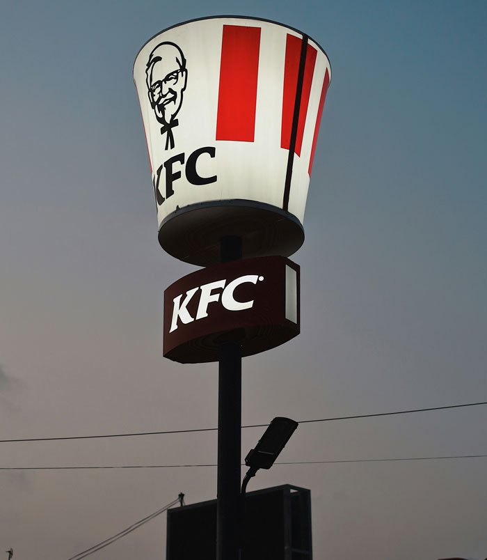 KFC bucket sign at dusk illustrating brand PR fail