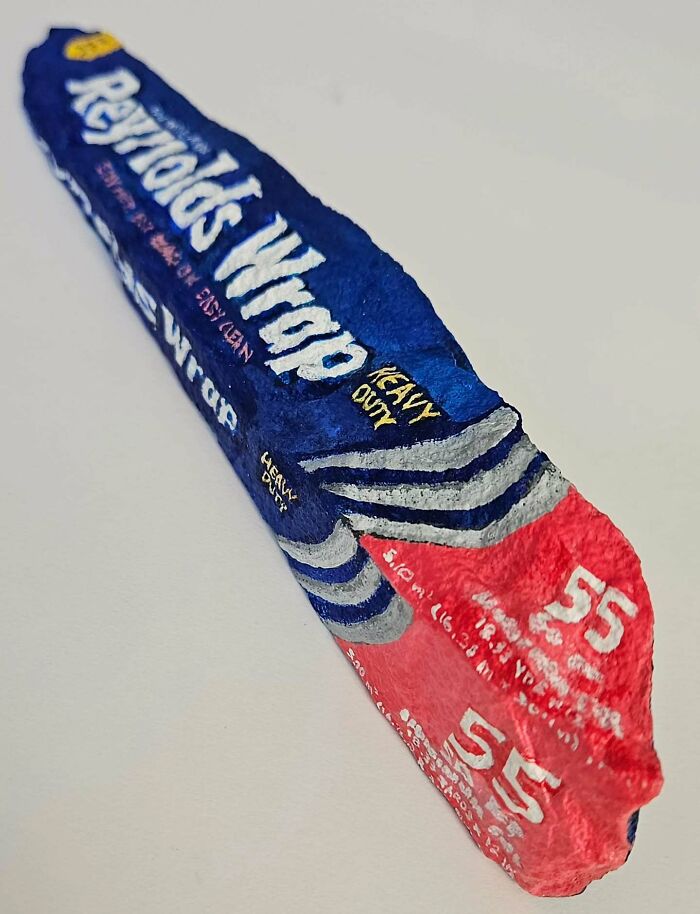 A stone creation painted as a Reynolds Wrap box. An artist turns rocks into iconic foods and famous products.