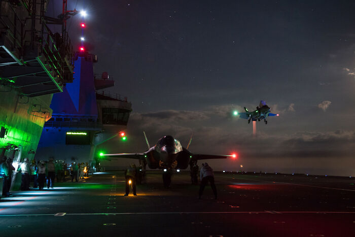 F-35 Lightning II Fighter Jets Conduct The First Ever Night-Time Flight Trials Aboard The Royal Navy Aircraft Carrier HMS Queen Elizabeth