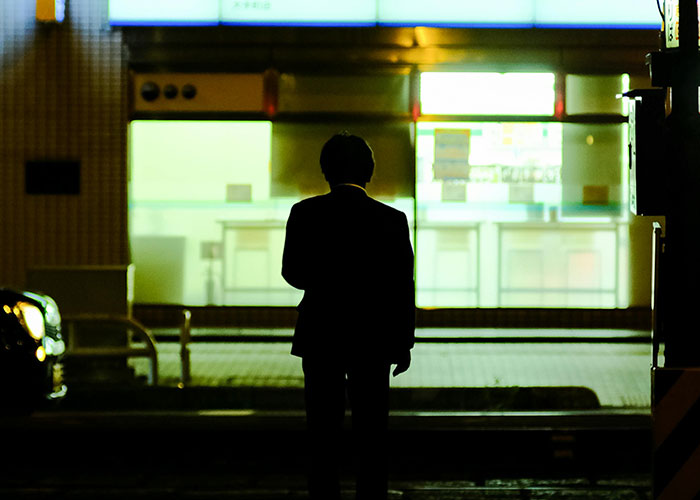 Silhouette of a man standing alone at night representing vanished people