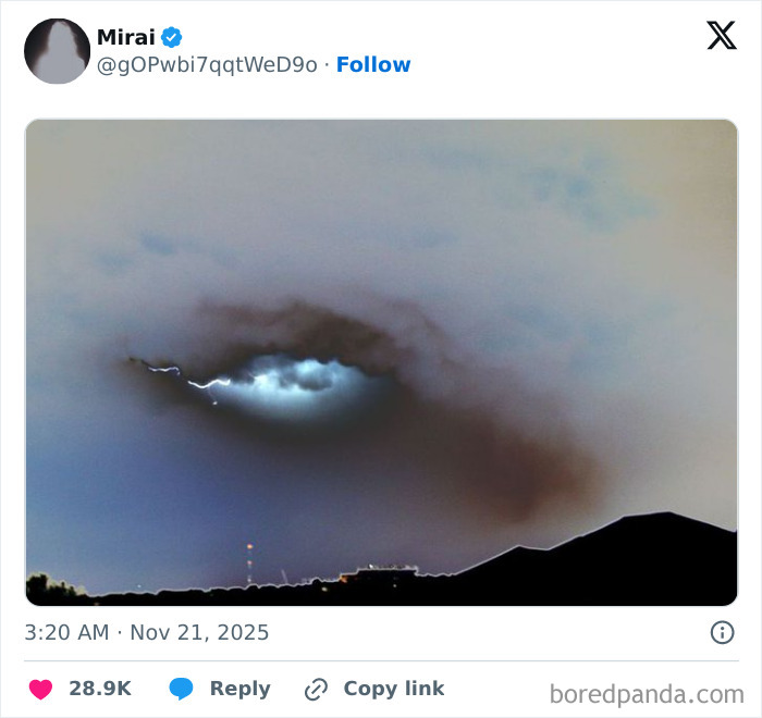 Cloud formation with light creating eye-like pareidolia in the sky