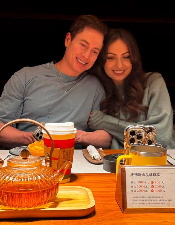Couple enjoying tea together with warm lighting for human experiment topic