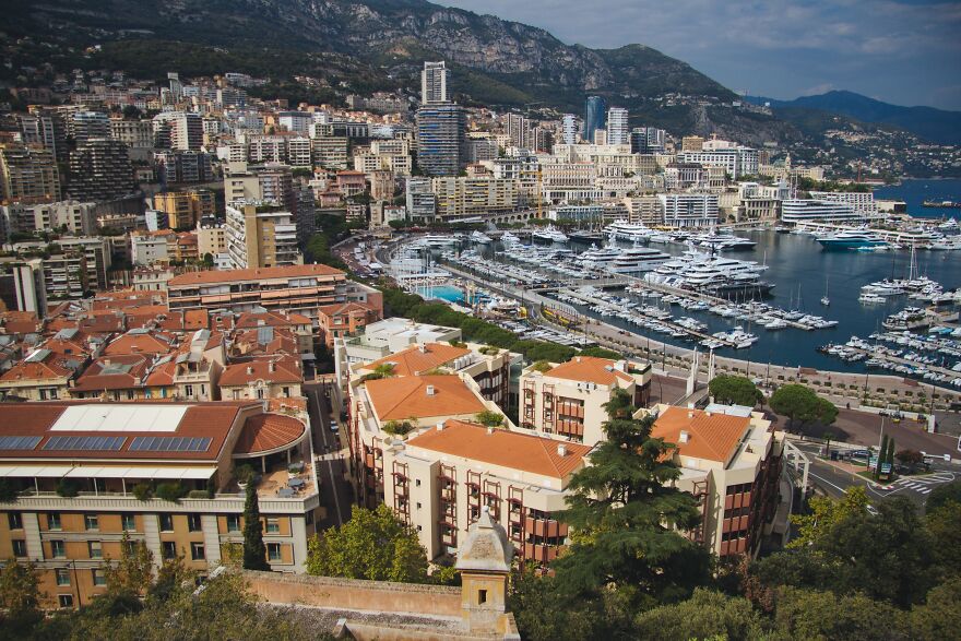 Aerial view of Monaco cityscape with harbor and yachts