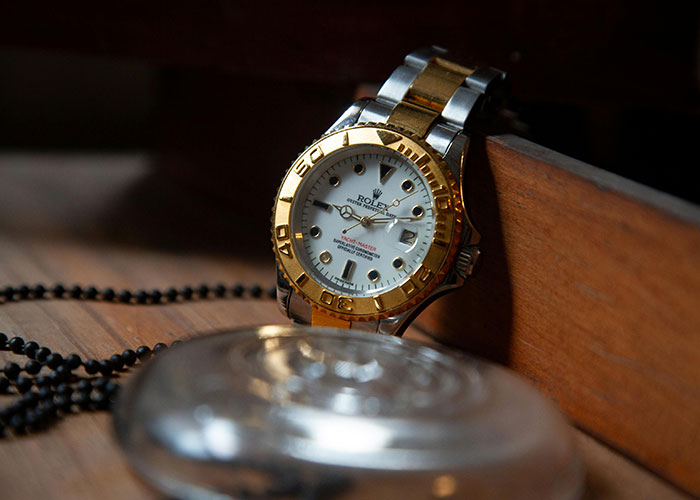 Luxury watch on wooden surface representing lost belongings in disappearances