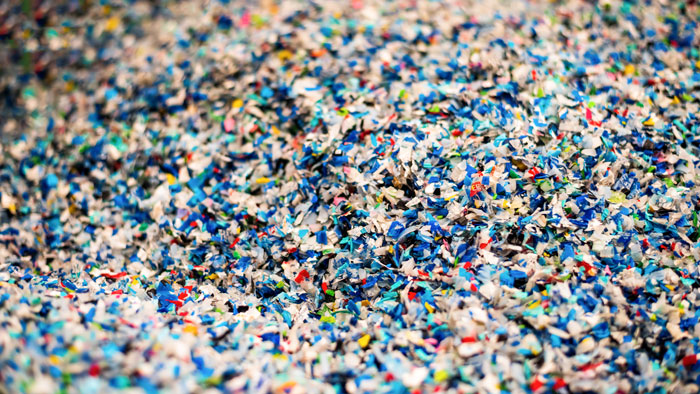 Close-up of shredded plastic waste representing environmental science
