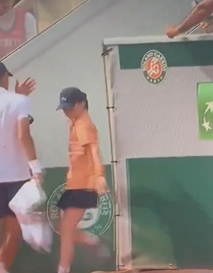 19-year-old French Open star pushing ball girl on tennis court during match