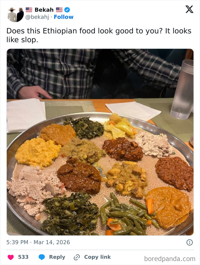 Ethiopian food platter with various stews on injera bread displayed on table