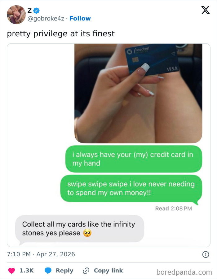 Credit card held with manicured nails illustrating pretty privilege spending