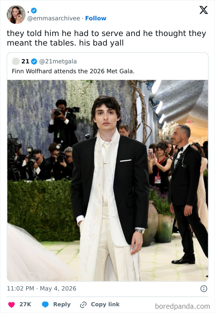 Finn Wolfhard in a black suit and white pants at the 2026 Met Gala, a celebrity guest reaction.