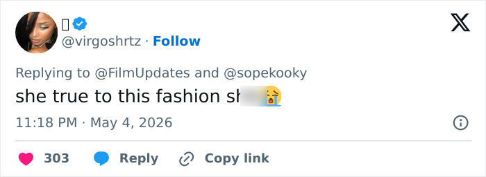 A tweet about Heidi Klum's Met Gala outfit, reading "she true to this fashion s[hit]," reacting to the disturbing look.