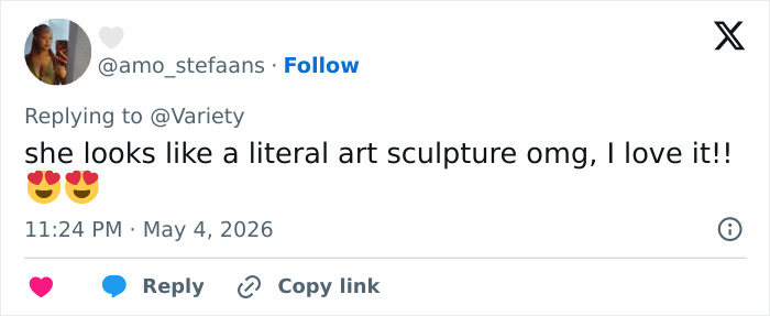 A tweet from @amo_stefaans praising a Met Gala outfit, saying 'she looks like a literal art sculpture omg, I love it!!'
