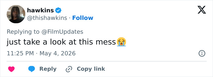A tweet from @thishawkins replying to @FilmUpdates about Heidi Klum's Met Gala outfit, calling it genuinely disturbing.